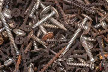 Background of iron nails screws construction steel metal texture macro close up hardware different old rusted  Top View