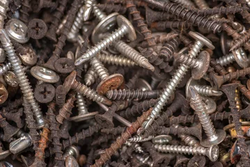 Photo sur Plexiglas Métal Background of iron nails screws construction steel metal texture macro close up hardware different old rusted  Top View
