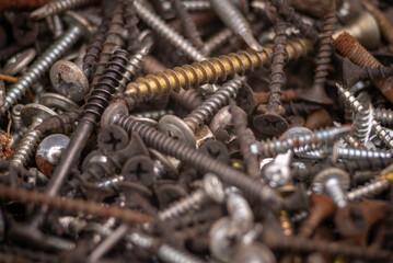 Background of iron nails screws construction steel metal texture macro close up hardware different old rusted  Top View