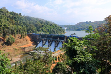 Water rushing through gates at peruvannamuzhi (peruvannamoozhi) dam, Kuttyady (Kuttiady, Kuttyadi), Kerala, India