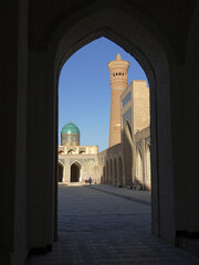 Fototapeta na wymiar Architectural complex with a large minaret in Bukhara
