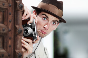 Retro photographer man, street and camera on investigation, inspection or suspicious journalist job in city. Private investigator, secret spy or vintage paparazzi with surprise for surveillance intel