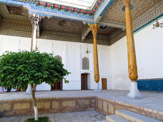 Architectural ensemble with wooden ceiling and columns in Bukhara