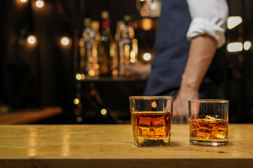 Bartender pouring Whiskey, on  bar,