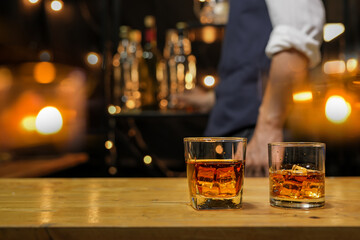 Bartender pouring Whiskey, on  bar,