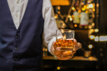 Bartender pouring Whiskey, on  bar,