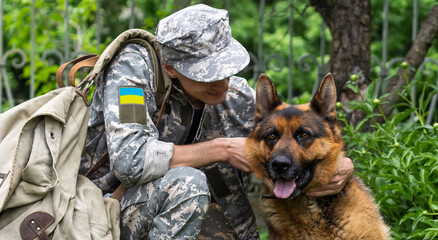 A Ukrainian soldier in military uniform with dog, yellow and blue flag.