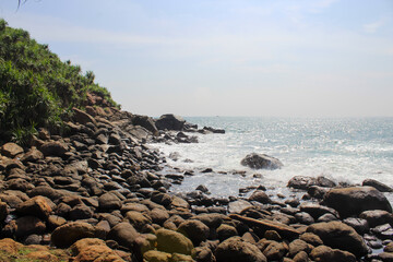 The black rocks at Jungle Beach, Unawatuna, Sri Lanka, baackground, copy space for text