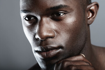 Art, beauty and serious face of black man on dark background with skin care, and dermatology....