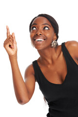 Happy, advertising and pointing with a black woman in studio isolated on a white background for information. Smile, marketing and hands gesture with a young female brand ambassador showing space