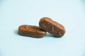 Delicious chocolate bars on a blue background