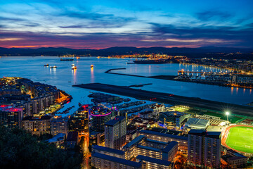 Sunset over Gibraltar town and the Bay of Gibraltar, UK - obrazy, fototapety, plakaty