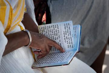 Ethiopian woman reading psalms in Hebrew during a celebration of the Sigd holiday in Jerusalem. 