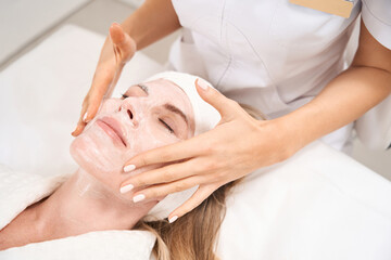 Female enjoys beauty treatments at the aesthetic medicine clinic