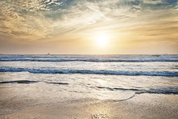 Fotobehang Beach, water and ocean with sunrise and mockup with blue sky and waves on horizon. Sea landscape, outdoor and nature with sunshine at the coast and seaside with sand and no people with clouds © peopleimages.com