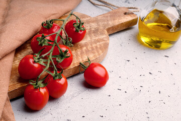 tomatoes  on wooden board and gray background
