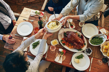 Food, table and family eating together for holiday celebration or dinner party with health...