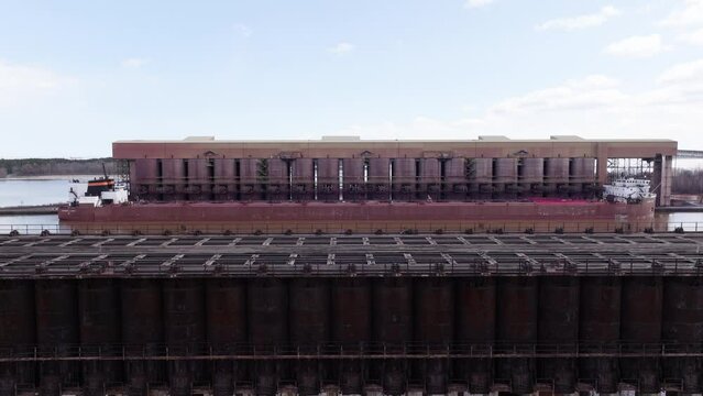 Ore docks loading iron taconite minerals onto freight ship docked in Superior, Wisconsin