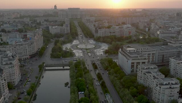 Unirii Boulevard, Union Square And Unipn Park With City Views During Sunset In Bucharest, Romania. - aerial