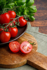 tomatoes and basil on wooden table