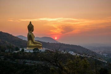 The big golden Buddha at Khao Wong Phra Chan at sunset