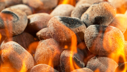 Freeze Motion Shot of Glowing Charcoal Briquettes on Garden Grill, Macro Shot