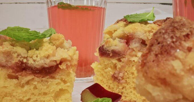 Homemade rhubarb cake as dessert served with compote.