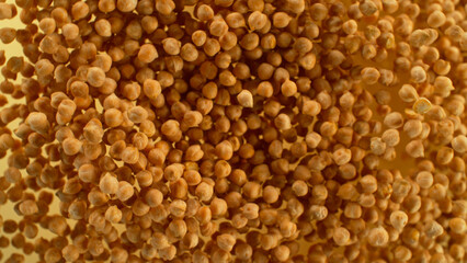 Freeze motion of flying chickpeas in the air, macro shot