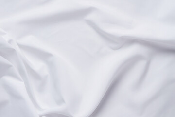 White fabric. luxurious white fabric texture background. Creases of satin, silk and cotton.