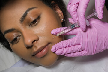 Young Woman Receiving Botox Injection In Beauty Clinic