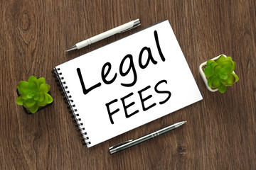 Business concept about Legal Fees with sign on the sheet.