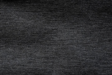 Black jeans fabric background texture. Black canvas fabric background texture. Close up view.