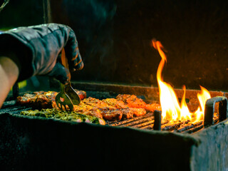 Chicken Leg Kebab  or Tengri Kebab are preparing on a Charcoal Oven.  
