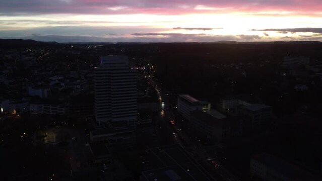 Aerial sunset Cityscape of Kaiserslautern : Municipality building and street traffic ( K-town ) in west Germany known for the U.S military Community of Ramstein Air force Base settling in the city.