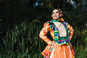 Latin woman dancer wearing traditional Mexican dress traditional from Guadalajara Jalisco Mexico Latin America, young hispanic people in independence day or cinco de mayo parade or cultural Festival