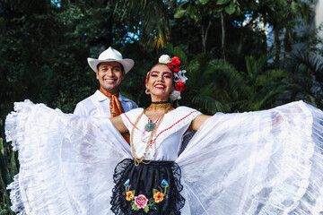 Latin couple of dancers wearing traditional Mexican dress from Veracruz Mexico Latin America, young...