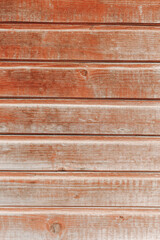 An aged wall background. Wooden brown planks. Close-up of a hardwood tree texture.
