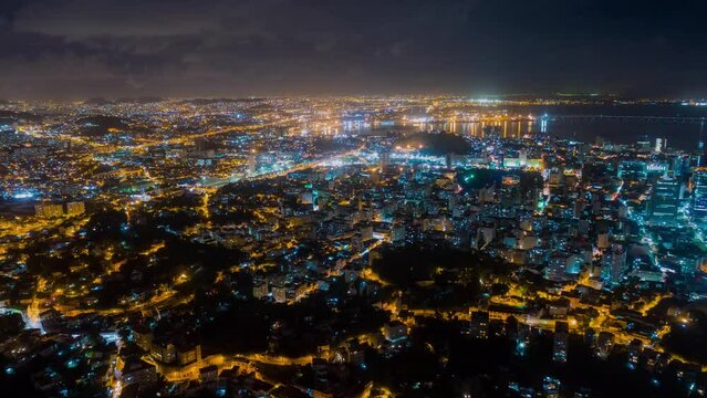 RIO DE JANEIRO, BRASIL - MAY, 2023: Drone aerial night timelapse view of of Botafogo beach and district on Guanabara Bay. City at night fro, above.