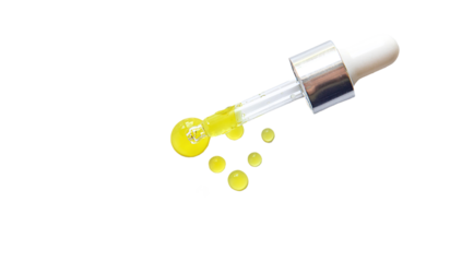 Drops of oil pipette isolate on white background. Selective focus.