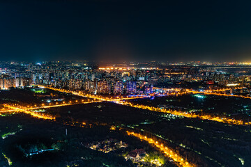 Fototapeta na wymiar Night scene of bustling buildings in Beijing city streets