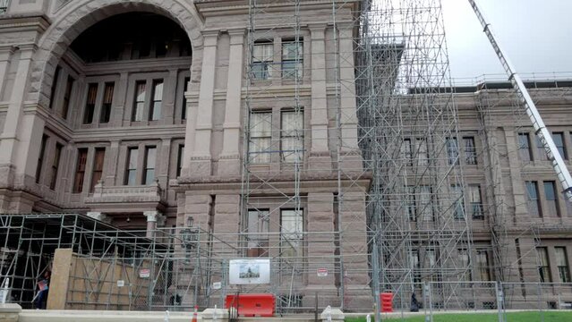 Construction out side the Texas state capitol building in Austin, Texas with close up pan left to right.