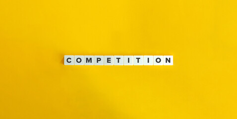 Competition Word on Block Letter Tiles on Yellow Background. Minimal Aesthetics.