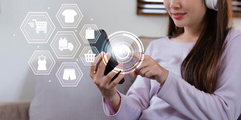 Online shopping and e-commerce concept. Young woman using mobile phone with shopping cart icon, order in online store, shopping on internet