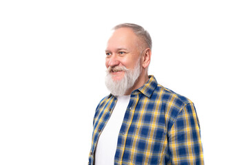 Obraz premium mature gray-haired retired man with a mustache and beard with a kind smile on a white background