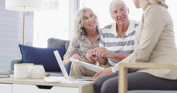 Home, help and senior couple with a financial advisor, consultation and discussion for investments. Female consultant, mature woman and elderly man in the lounge, documents for pension and insurance