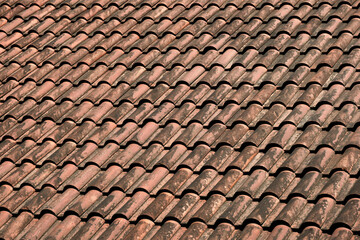 Close-up natural tiled roofs in red color.