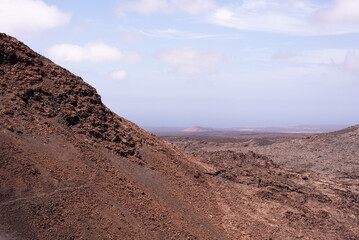 Amazing lunar landscape of Timanfaya National Park on the volcanic island of Lanzarote in Spain.