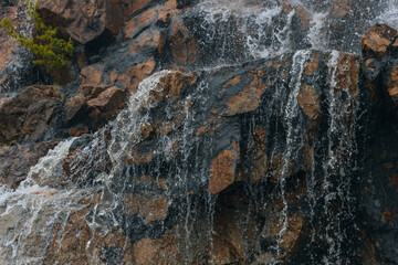 Waterfall Loud threshold on the slope of the Monastery Island in the Dnieper, Ukraine. Artificial decorative waterfall.