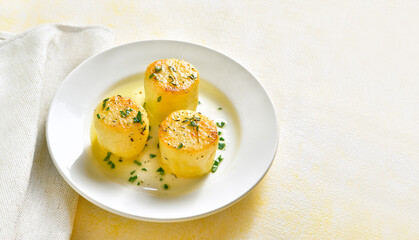 Fondant potatoes on plate