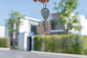 lease, rental and selling home. Real estate agent manager smile holding key for new owner.  rent...